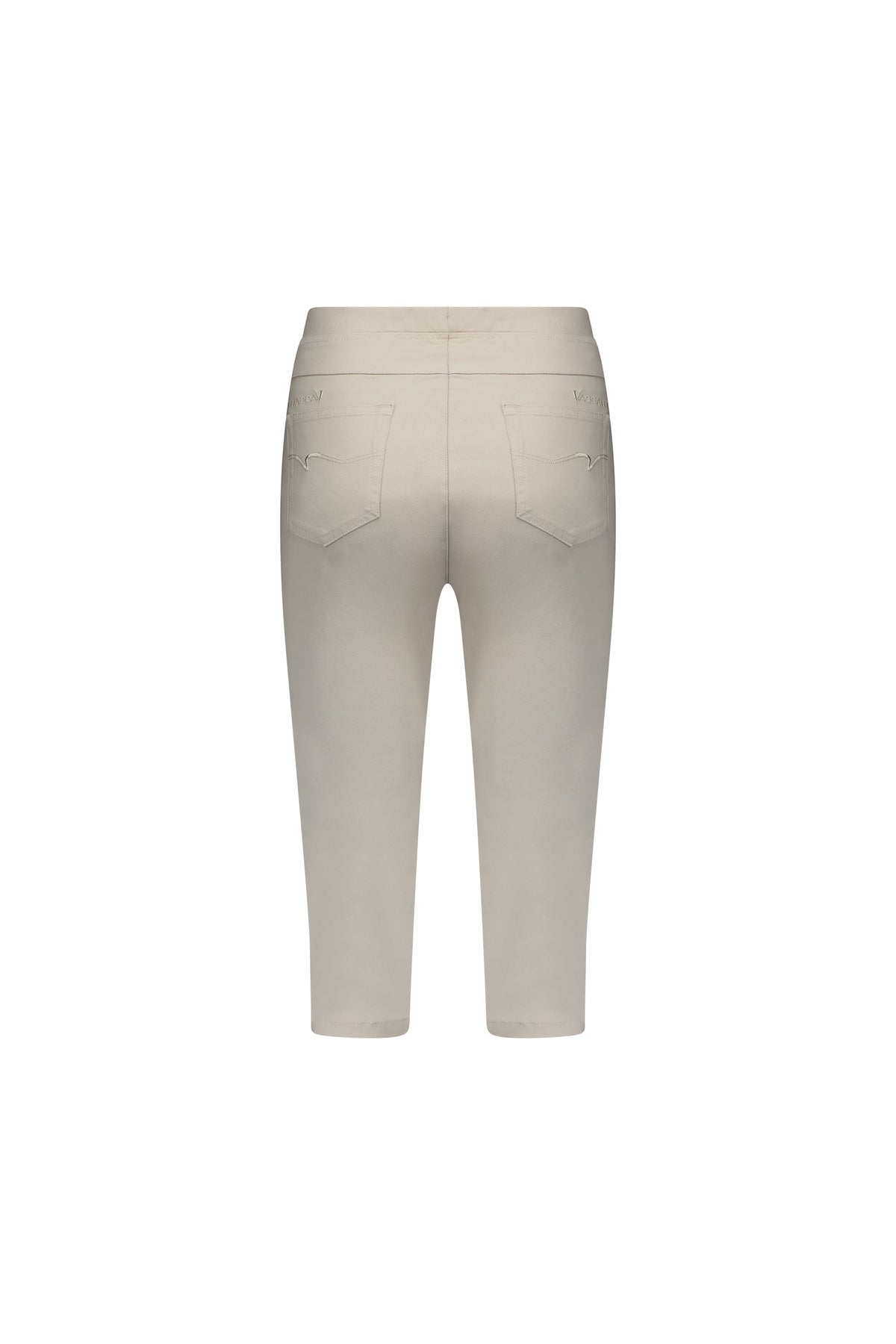 The Vassalli Atlas 3/4 Pant in Pumice is a beige, mid-rise, skinny leg cropped style with two rear pockets and subtle stitching details, crafted from stretch fabric and shown from the back against a white background.