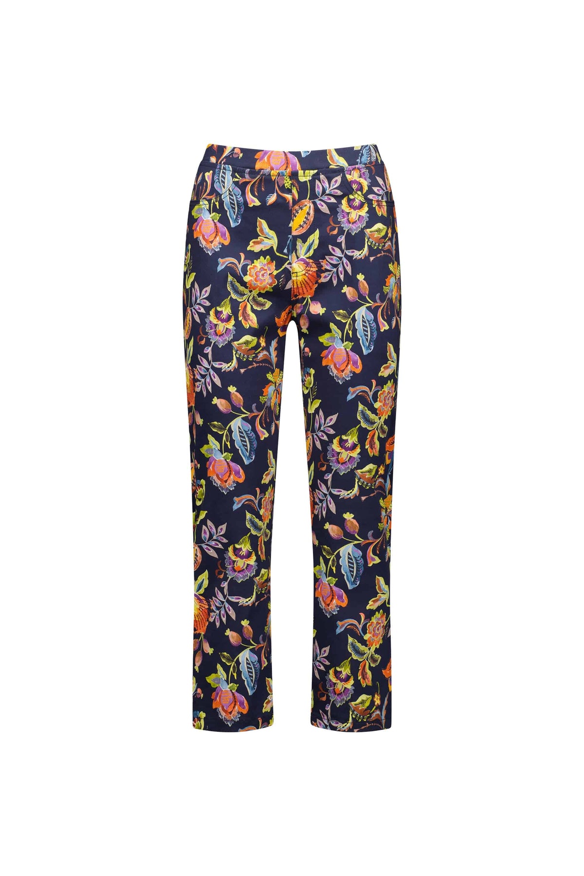 The Vassalli Sierra 7/8 Pant - Brazil features a navy blue base with a vibrant floral print in yellow, red, orange, and blue. These pull-on women’s pants have a straight-leg cut and two front pockets. Shown on a white background.