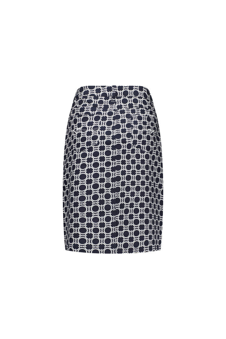 The Vassalli Poppy Skirt - Arlo is a high-waisted skirt with a black base and white geometric oval pattern, crafted from lightweight stretch fabric and shown on a plain white background.