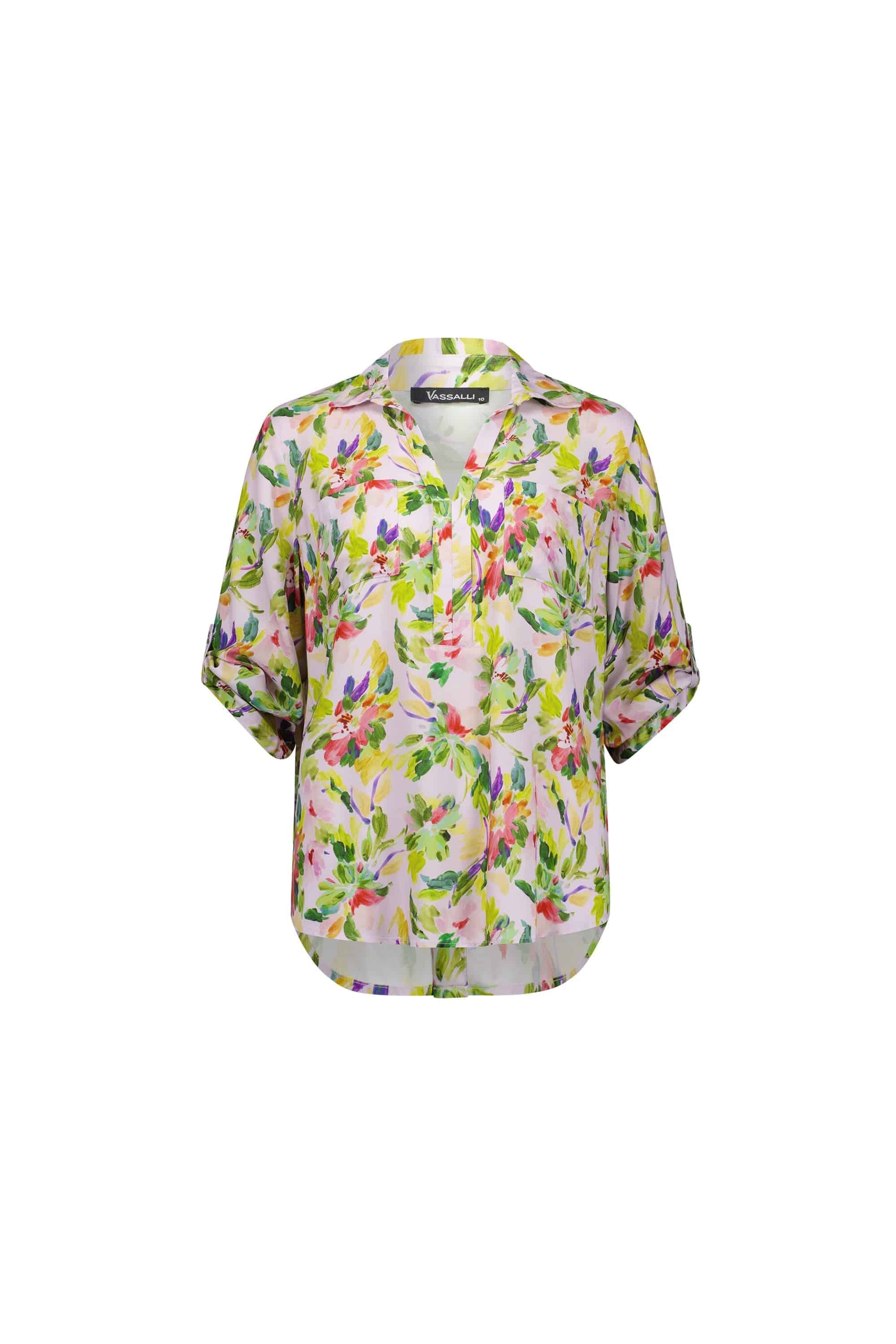The Vassalli Placket Shirt - Capri is a lightweight, short-sleeve blouse with a colorful print in green, pink, purple, and yellow shades. It features a V-neck and a slightly curved hem.