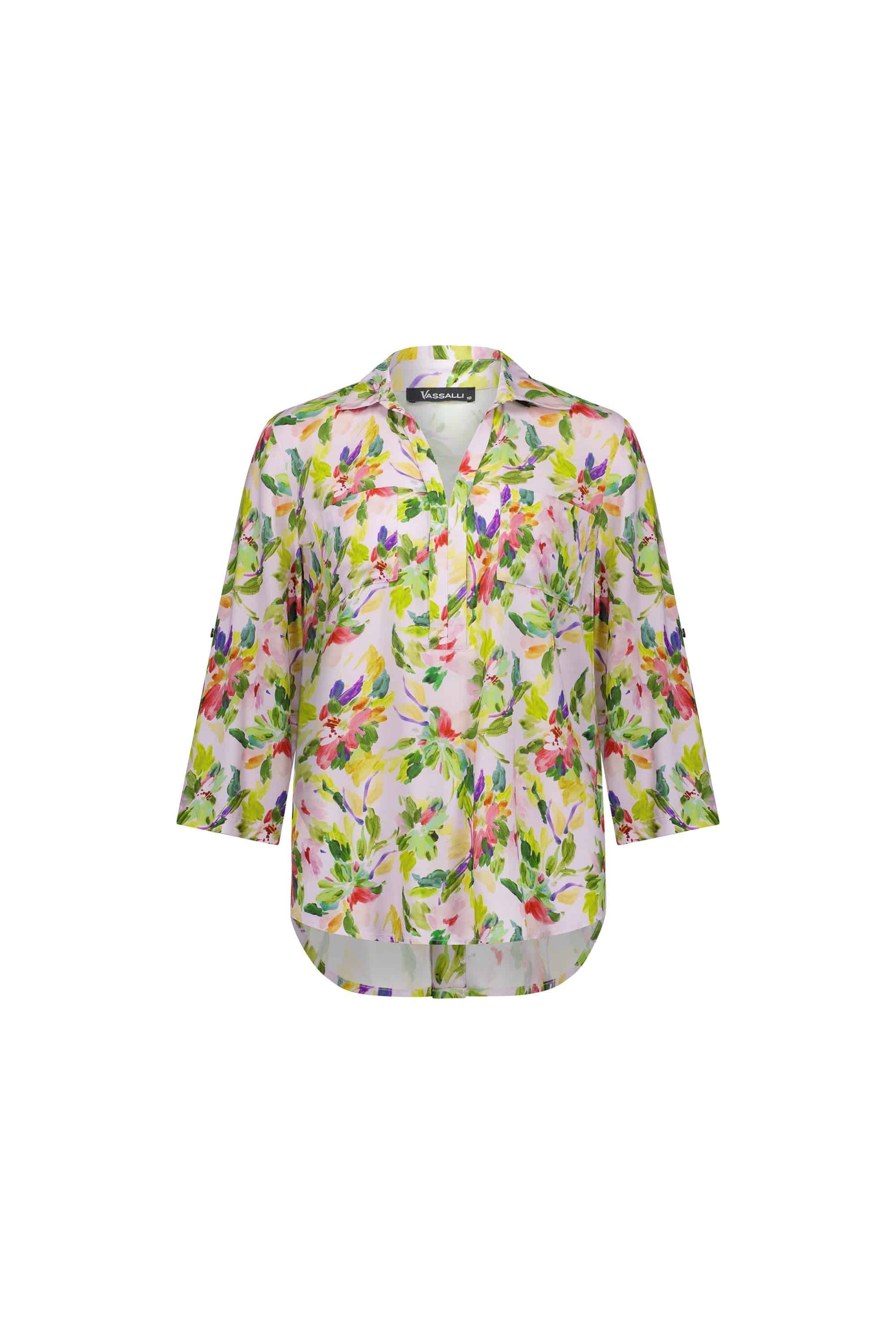 The Vassalli Placket Shirt - Capri is a women’s long-sleeve blouse with a vibrant green, pink, purple, and yellow capri print. It features a collar, button tab sleeves, and a button-down front on a white background.