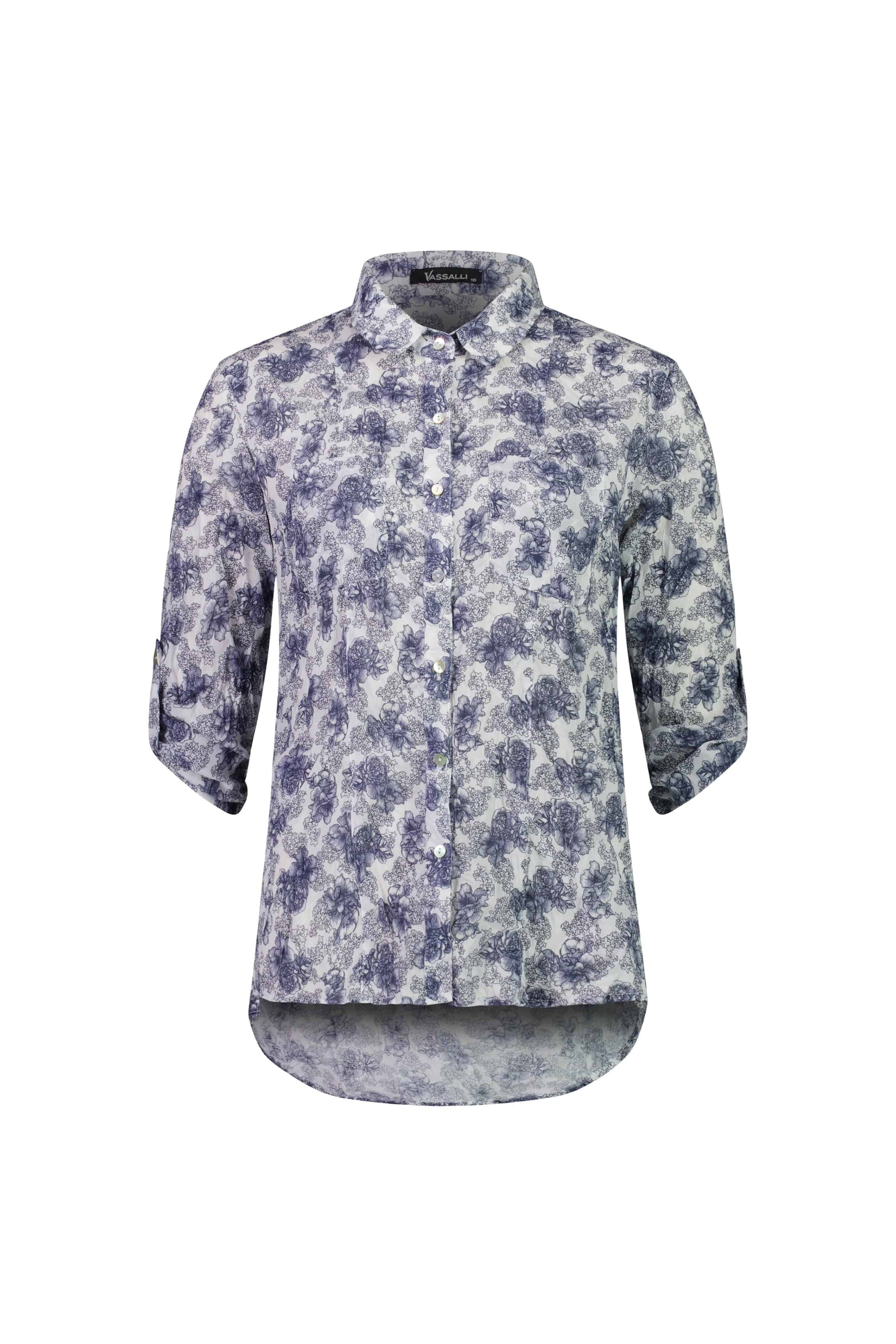 The Vassalli Crinkle Shirt - Denim Floral is a white shirt with a blue floral print, featuring a collar and three-quarter sleeves secured by buttoned tabs.