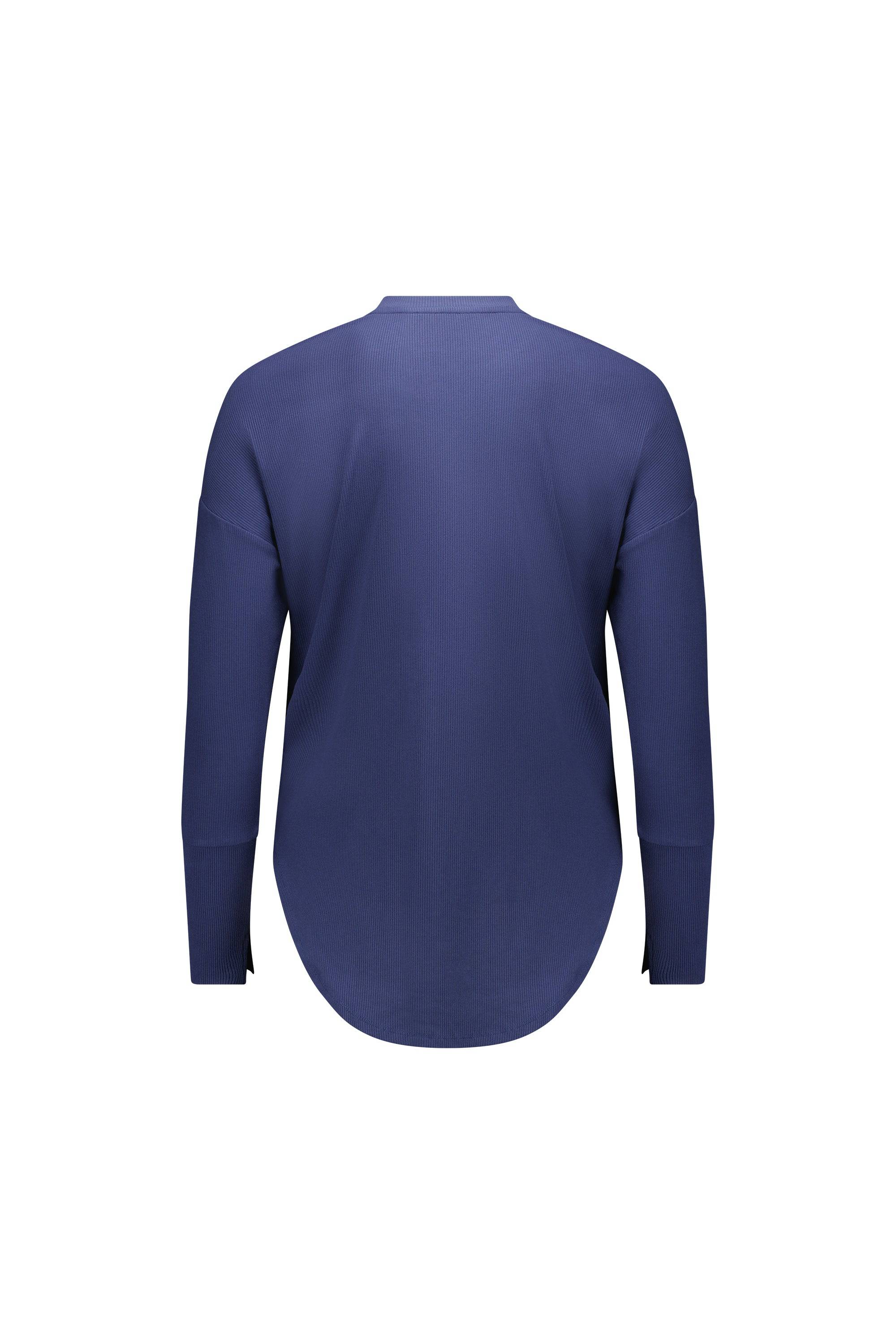 Back view of the Vassalli Round Neck Top in denim blue, featuring long sleeves, ribbed texture, a rounded hem, and a relaxed fit, shown on a white background.
