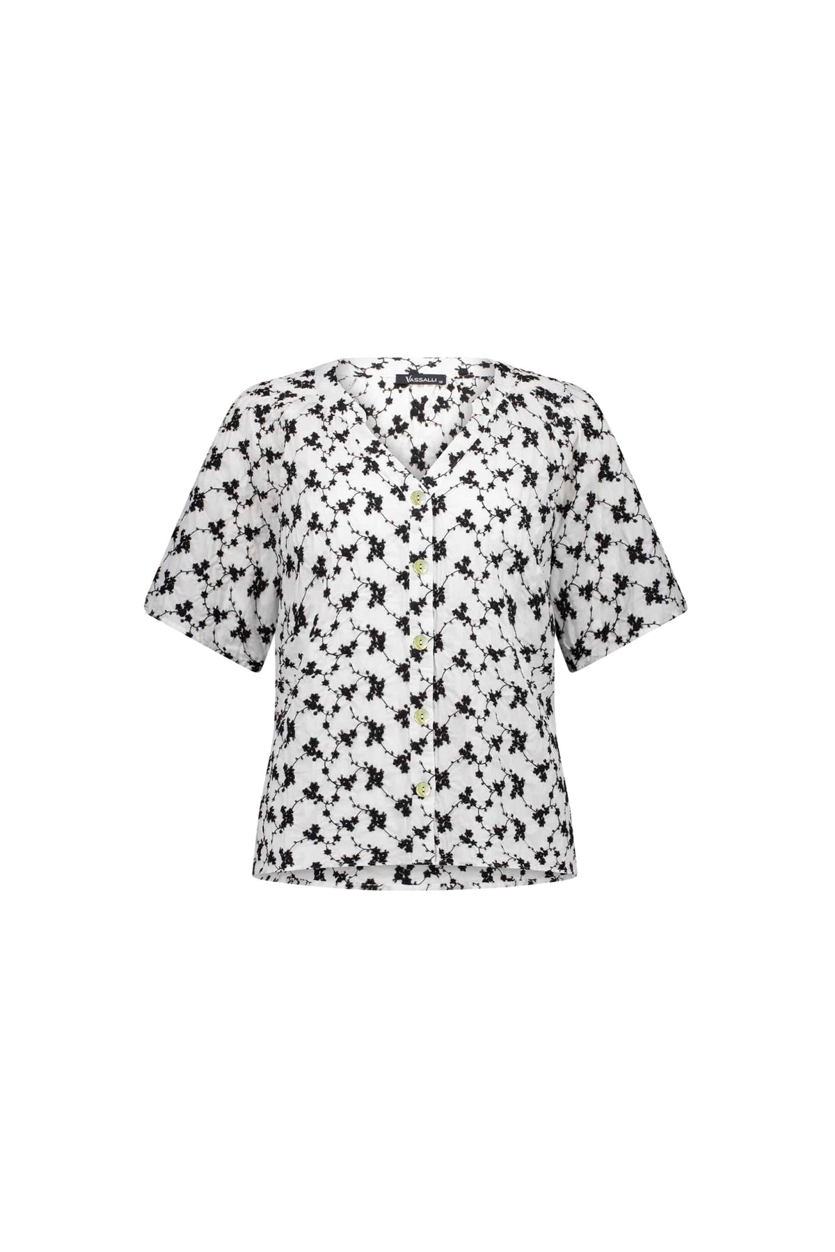 The Vassalli V-Neck Top - Floral features a black abstract floral print and short sleeves, with a button-up V-neck, shown on a plain white background.