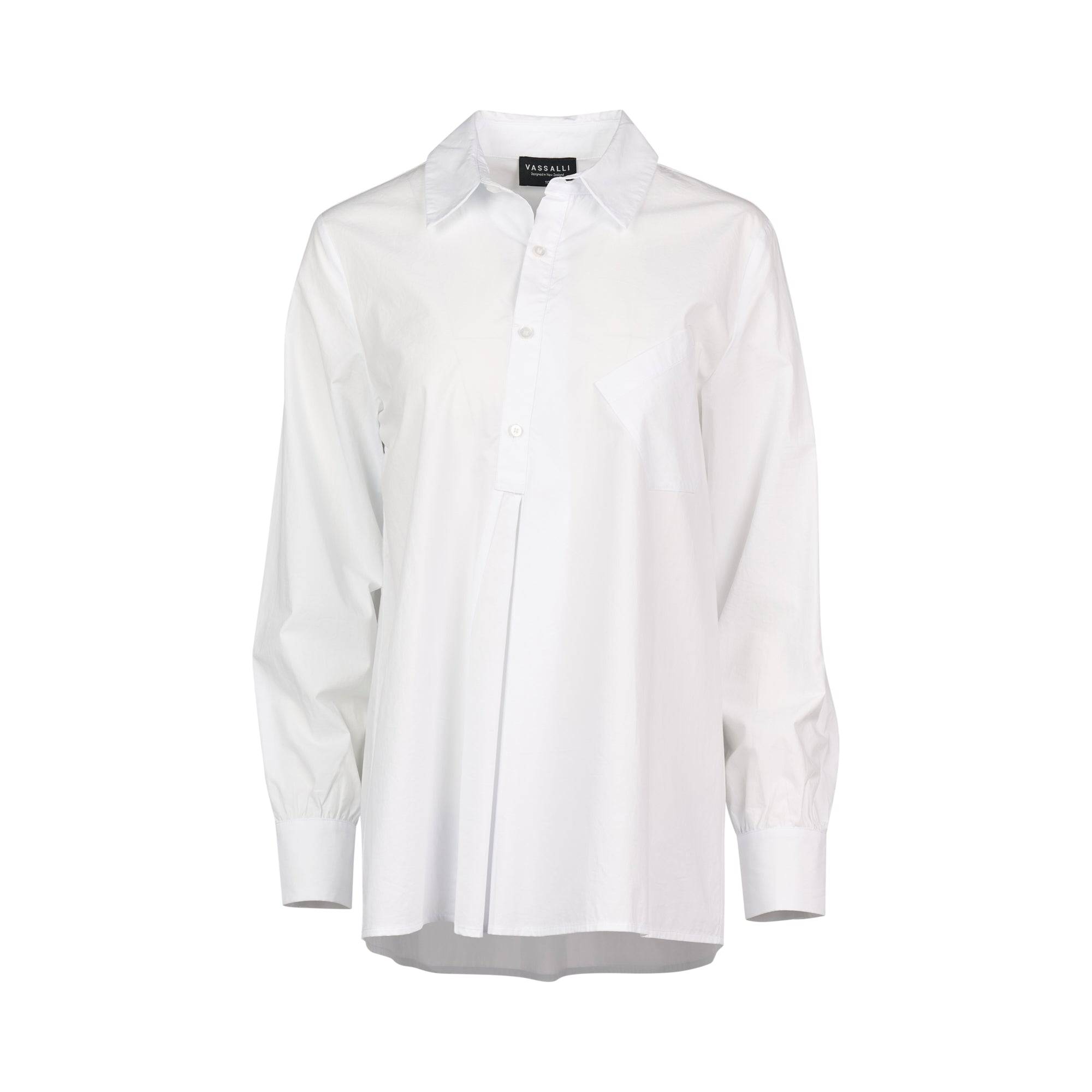 The Vassalli Half Placket Shirt in white is a cotton, long-sleeve button-up top featuring a classic collar, chest pocket, and relaxed fit. Designed with pleated details below the buttons and finished with cuffs at the sleeves, this shirt is displayed against a plain white background.