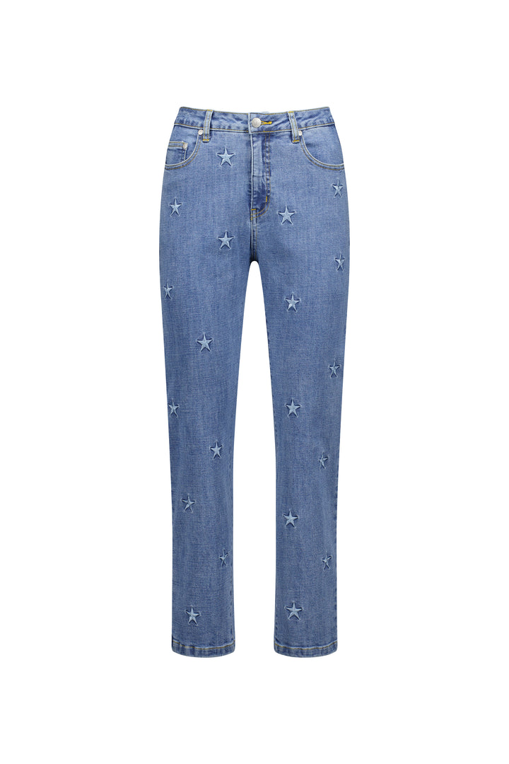 The Vassalli Onya Jean in light wash features a straight-leg, ankle-grazer fit with small embroidered white stars, five-pocket styling, and a button-zip closure.