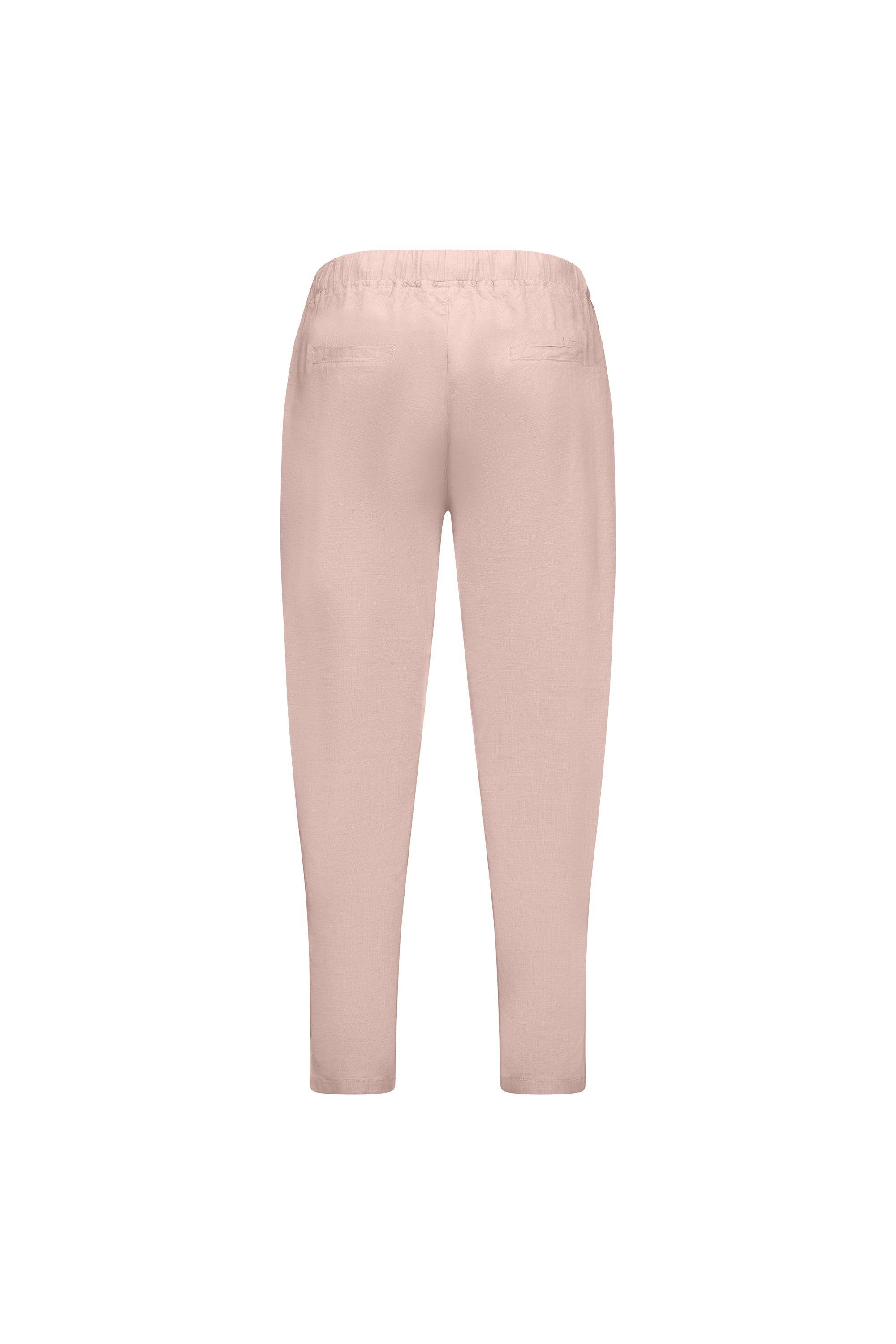 Back view of Vassalli Denver 7/8 Pant in Soft Pink, featuring a skinny leg, elastic waistband, and two back pockets, shown on a white background.
