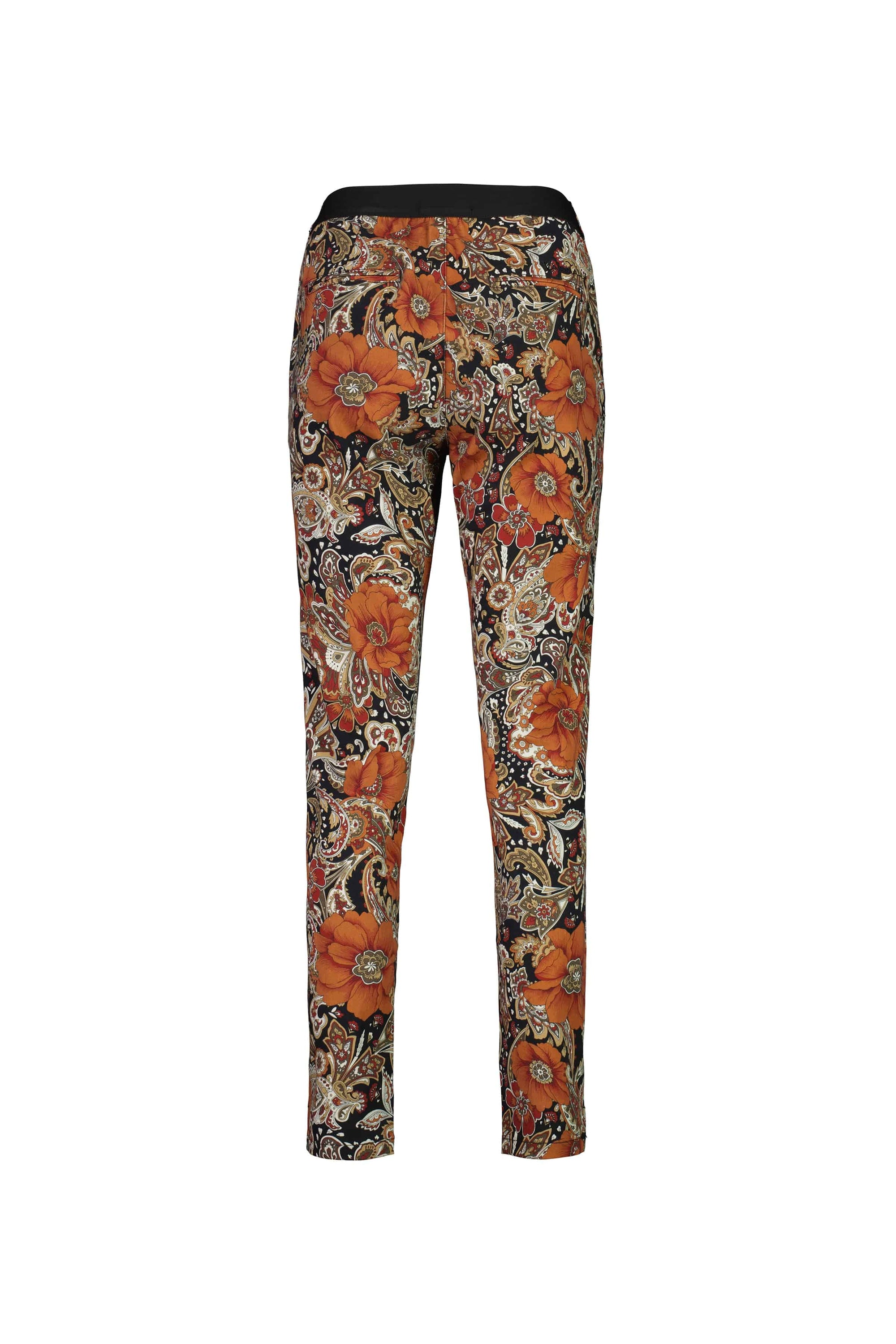 The Vassalli Ankle Grazer Pant - Bohemian features a slim fit and intricate orange, black, and beige floral-paisley prints, shown from the back against a white background.