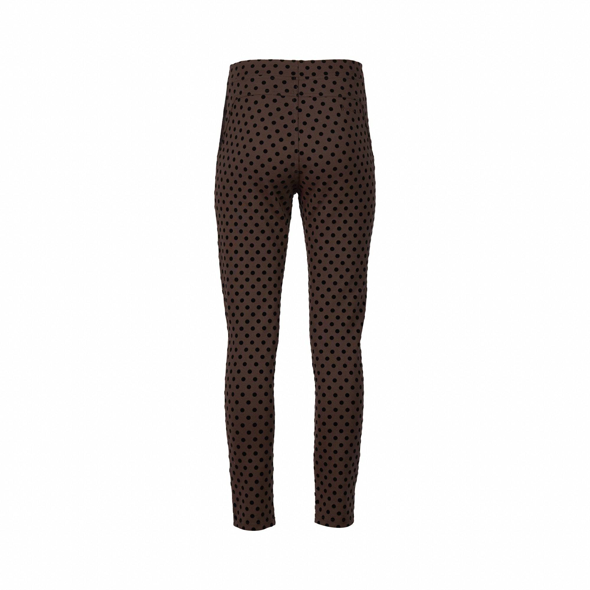 The Vassalli View Pant in Chocolate is a high-waisted stretch ponti pant with a black polka dot print. Featuring a skinny leg, ankle-grazer fit, this style delivers both comfort and versatility. Shown against a plain white background.