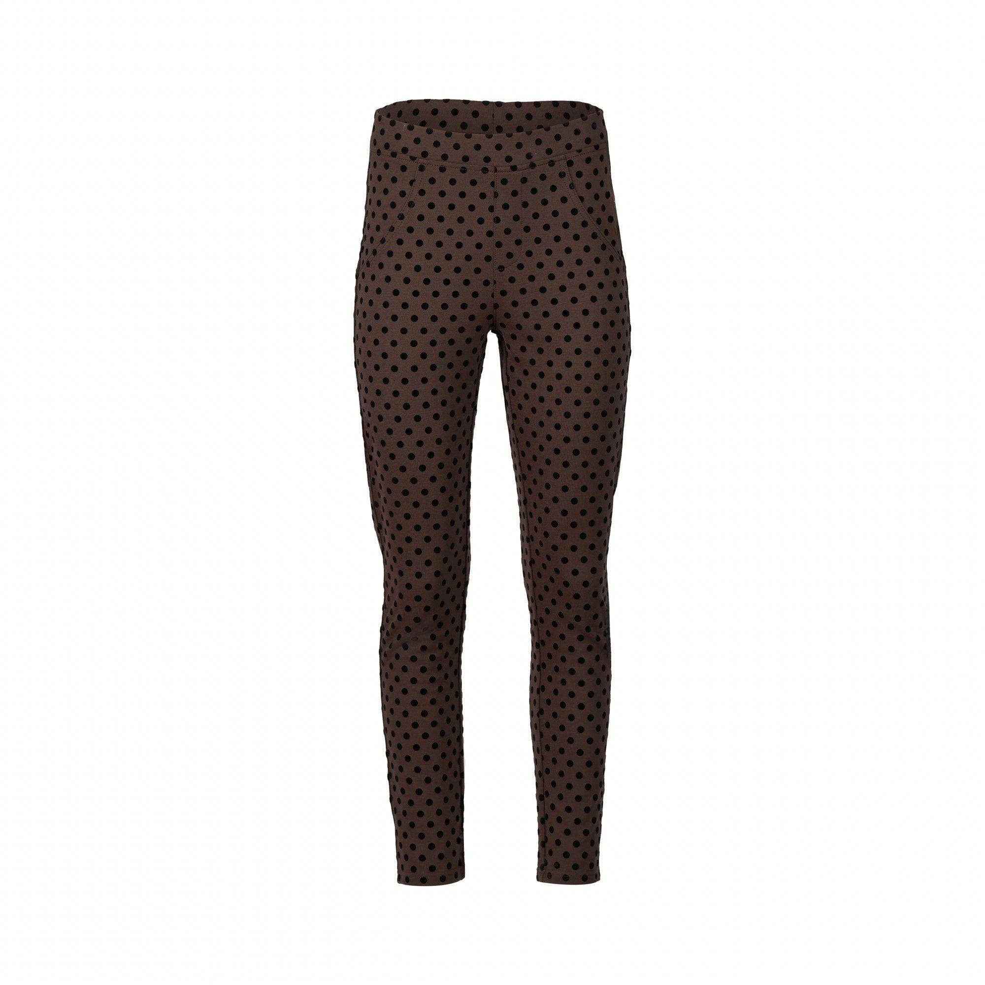 The Vassalli View Pant - Chocolate is a brown high-waisted printed ponti pant with black polka dots, made from stretch fabric for comfort. This skinny leg ankle grazer is shown against a plain white background.