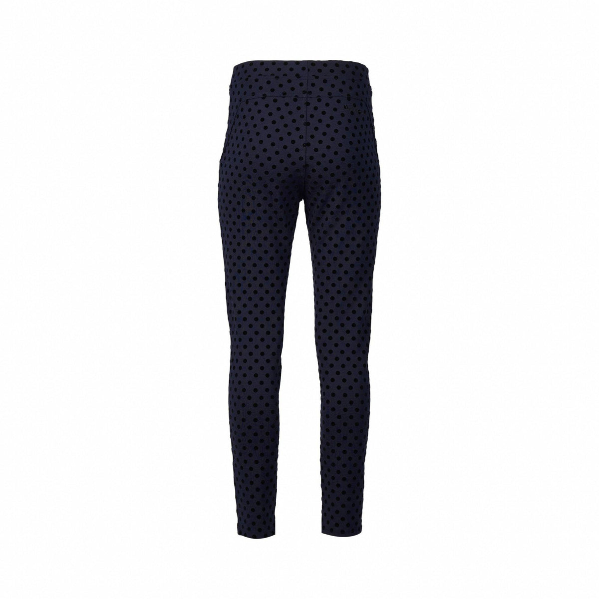 Back view of Vassalli's View Pant - Navy, a high-waisted, slim-fit style with a black polka dot print and skinny leg ankle grazer cut, shown on a plain white background.