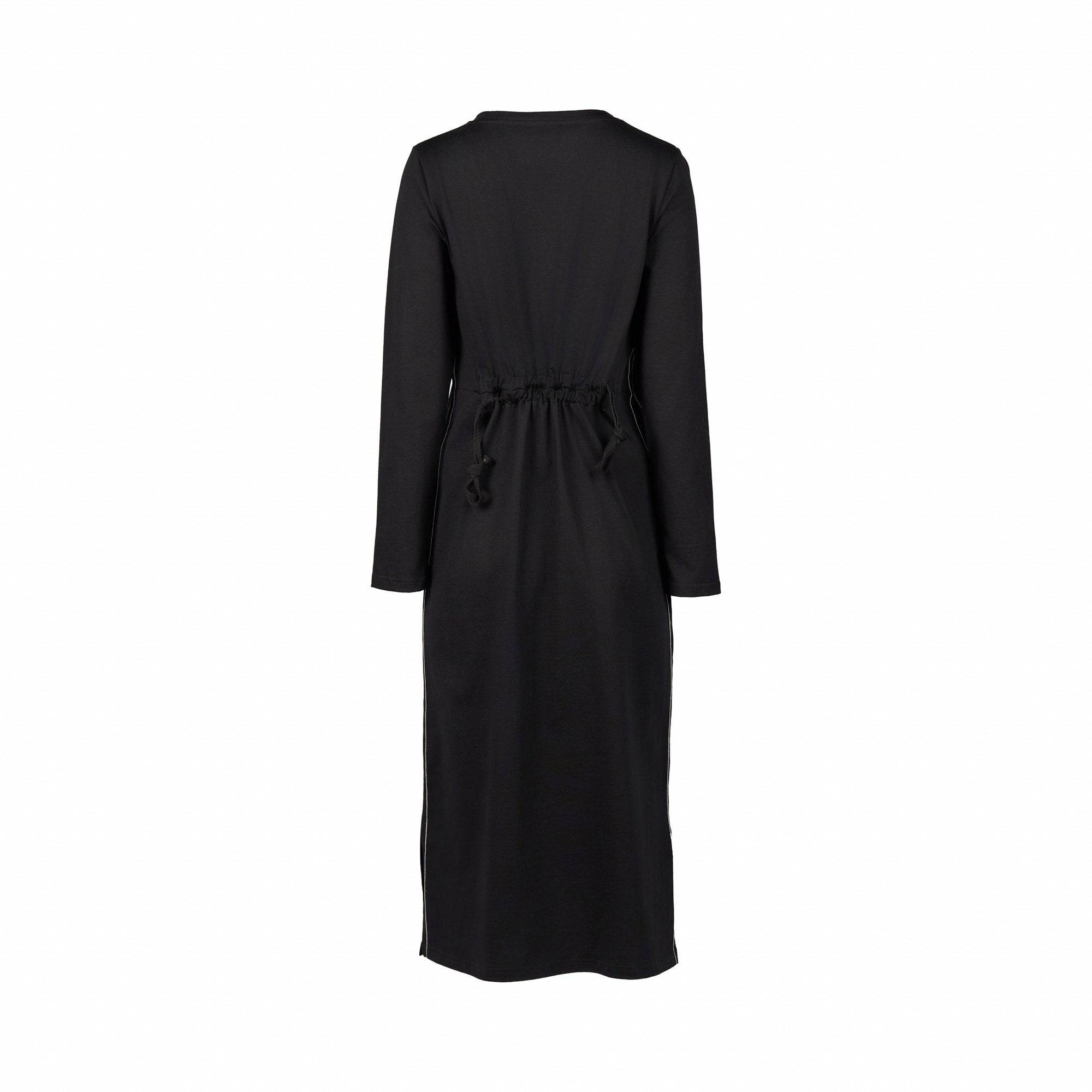 The Vassalli Knit Dress - Black/White is a long-sleeved midi dress showcased from the back, featuring a cinched waist with adjustable drawstrings and a straight hem. Crafted from soft knit fabric, this dress offers a relaxed loose fit for effortless comfort and style.