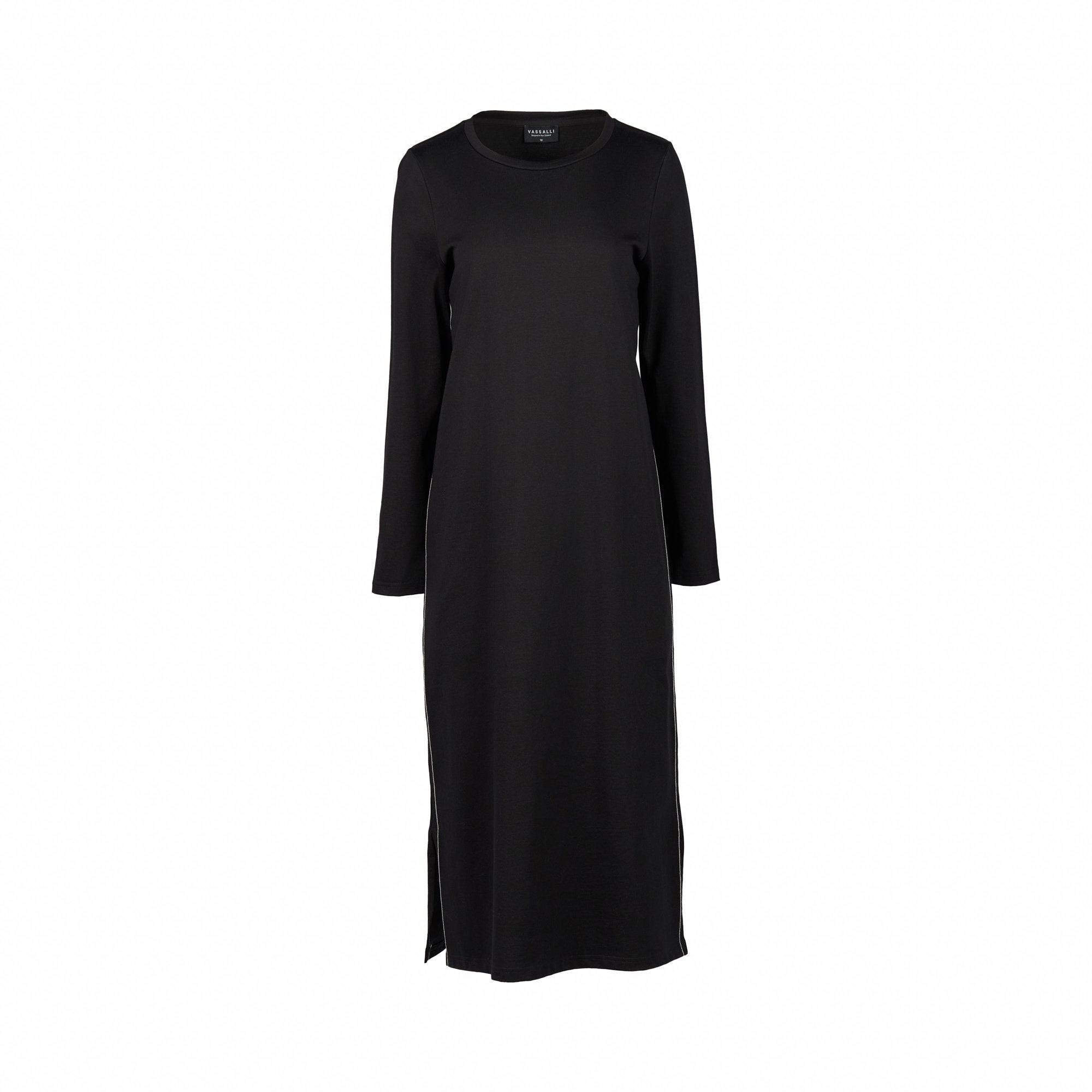 A long-sleeved, ankle-length Vassalli Knit Dress - Black/White with a round neckline, crafted from soft knit fabric. This dress by Vassalli has a minimal design, featuring a simple straight cut and relaxed loose fit, shown against a white background.