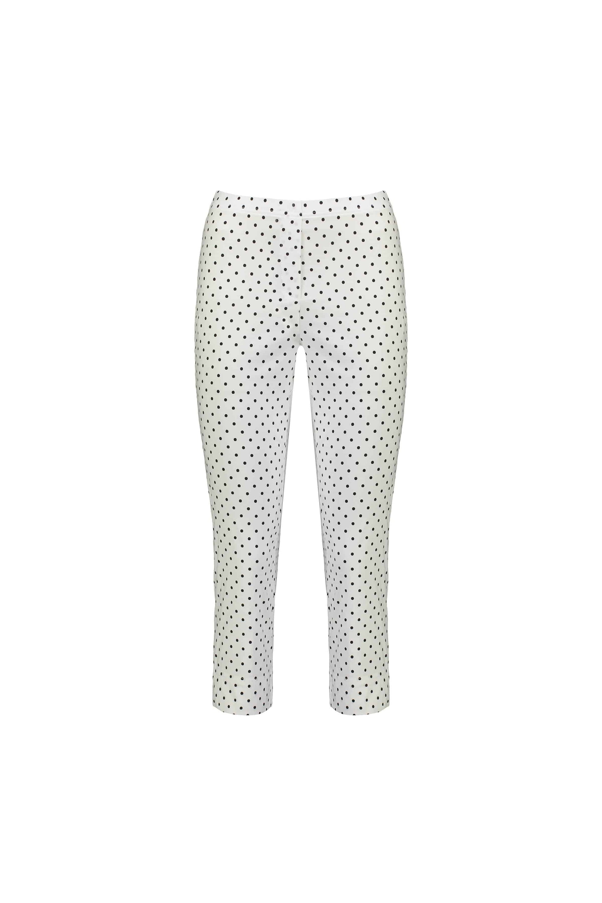 The Vassalli Paris Printed Crop Pant - Spot features a white, slim-fit ankle-length design with black polka dots, made from stretch fabric and shown against a plain white background.