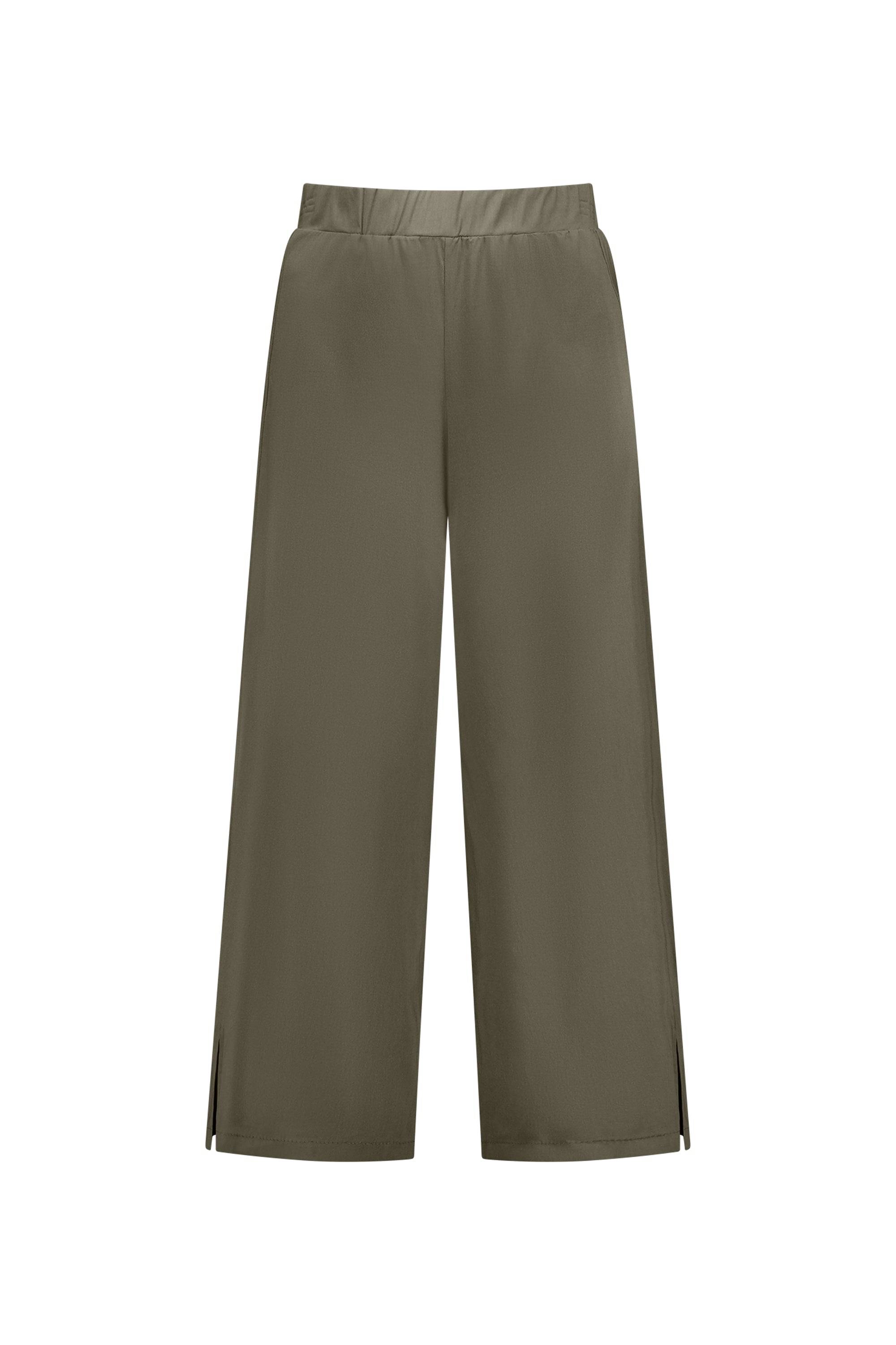 The Vassalli Paris Wide Leg Crop in khaki has an elastic waistband and small slits at the hems. Made from stretch fabric, these stylish and comfortable pants are shown on a white background.