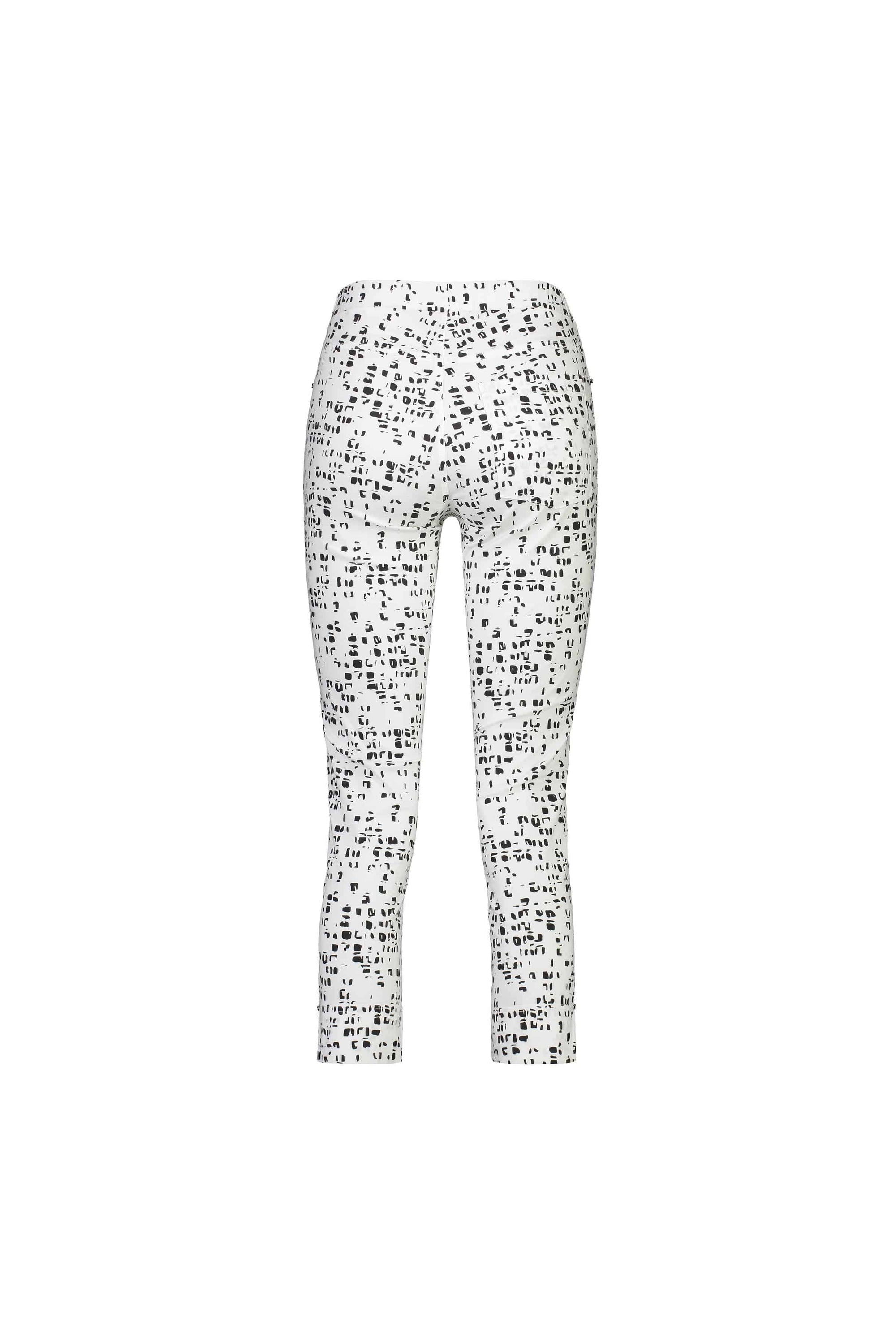 The Vassalli Paris Printed Tour Capri - Tonic features a high waist, cropped ankles, and stretch fabric with an all-over black abstract dot print on white. Shown here on a plain background.