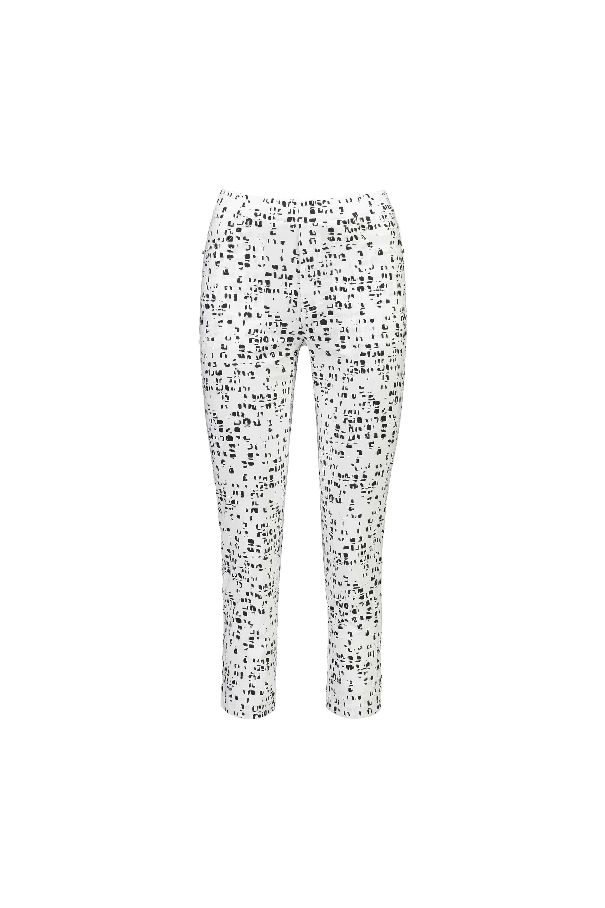Vassalli’s Paris Printed Tour Capri - Tonic are white slim-fit pants featuring a black abstract dotted pattern and comfortable stretch fabric, shown on a plain white background.