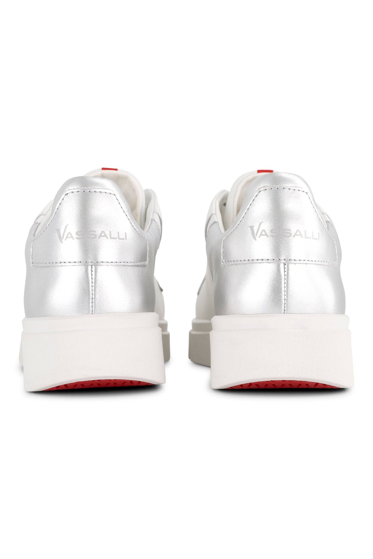Rear view of the Vassalli VS-001 White/Silver Laced Sneaker, showcasing chunky platform leather soles and bold red accents on the heel tab and outsole, set against a clean white background.