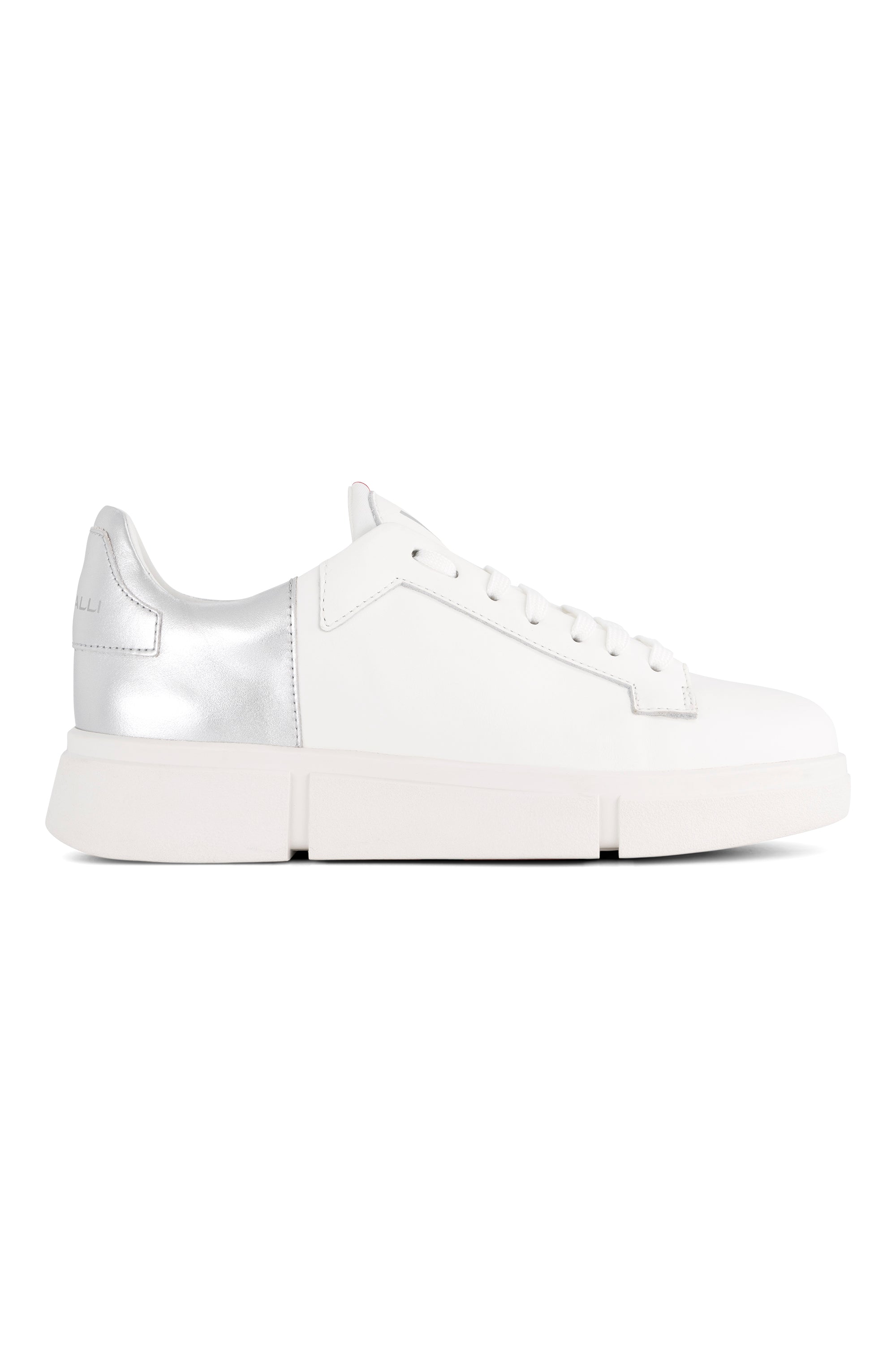 The Vassalli VS-001 White/Silver Laced Sneaker features a white low-top leather design with a thick platform sole, white laces, and a metallic silver heel accent, making it stand out stylishly against any background.