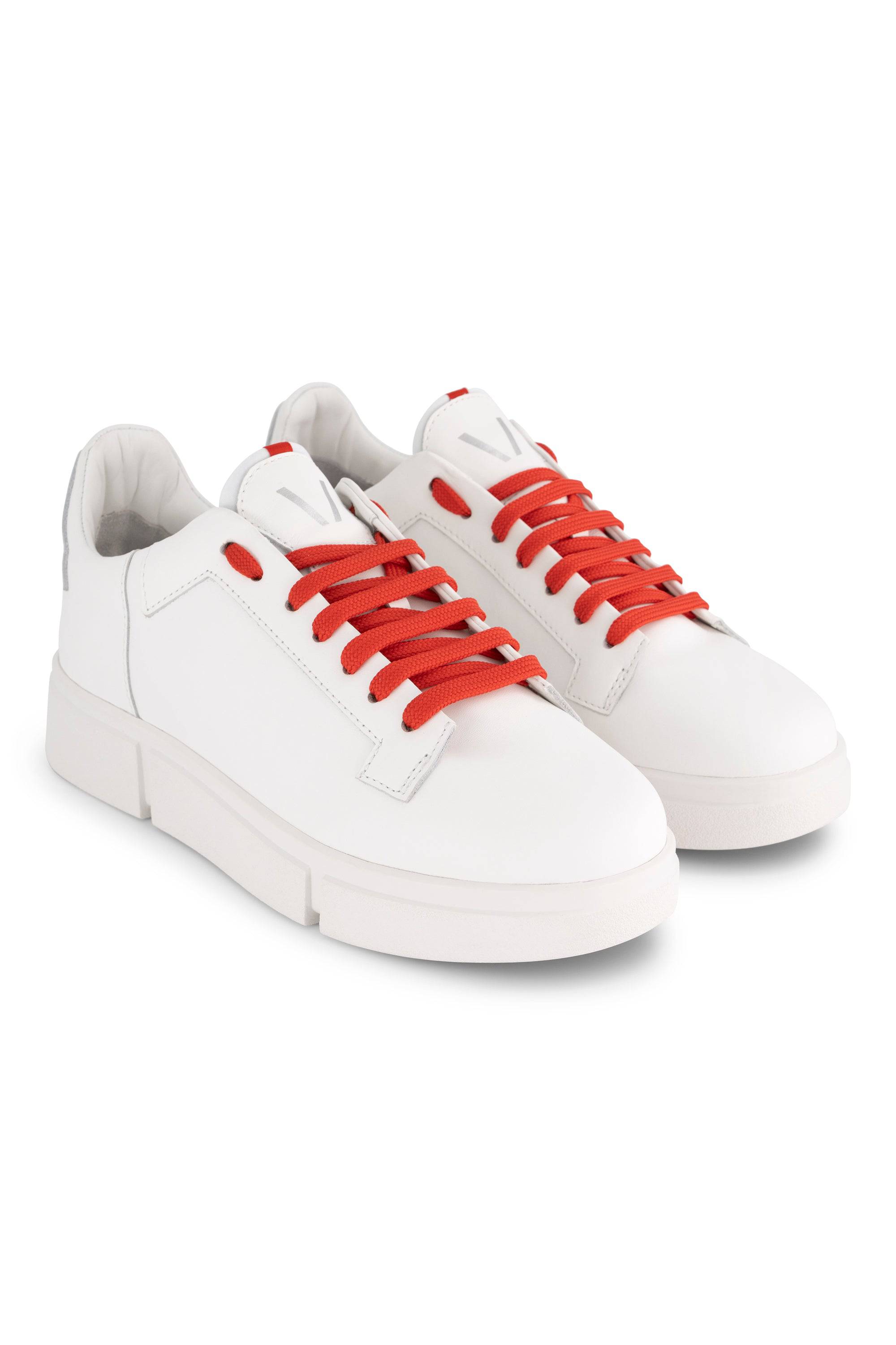 A pair of Vassalli VS-001 White/White Laced Sneakers with bright red laces, featuring a minimal leather design, subtle stitching, and solid white sole, are shown against a plain white background.