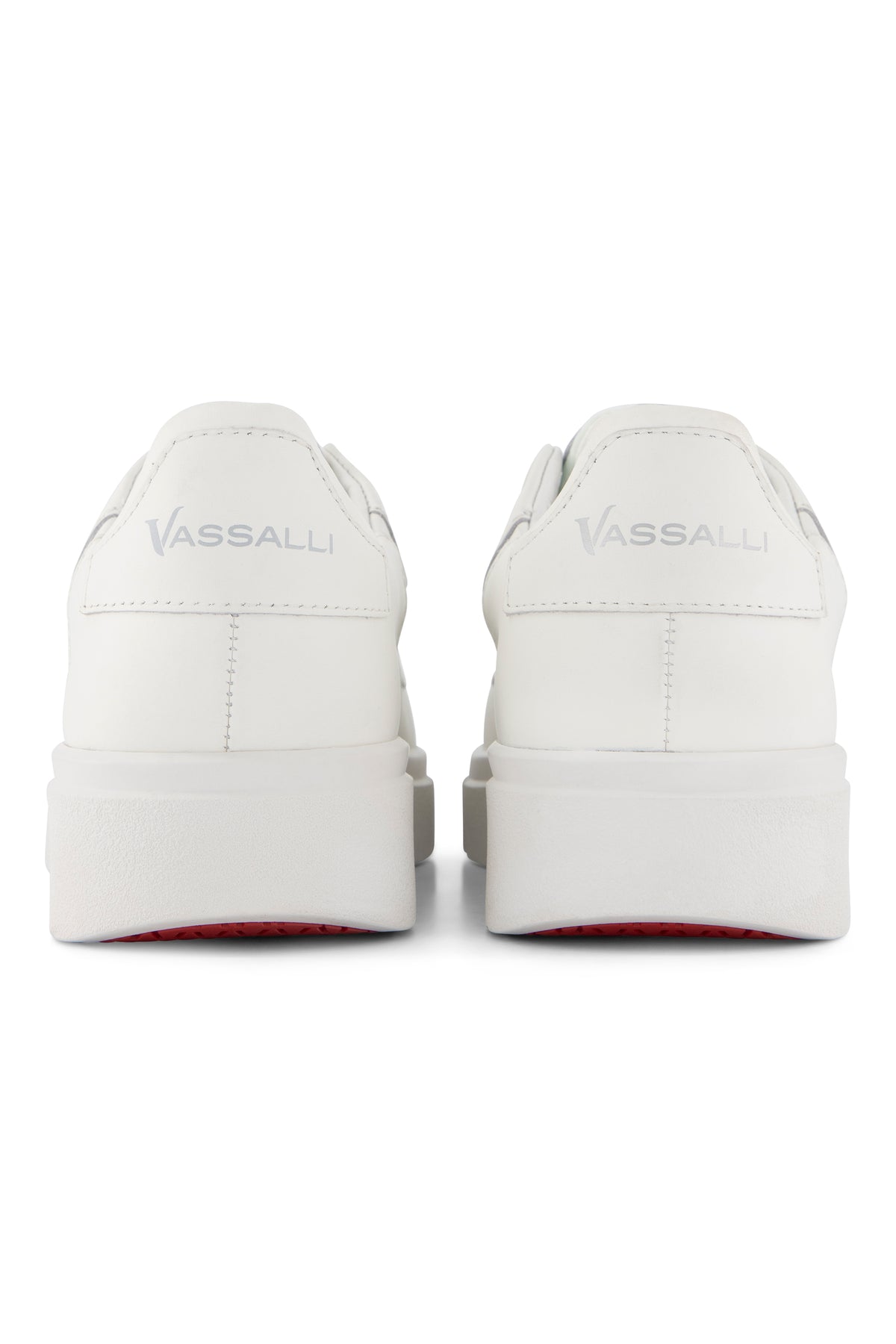 Back view of two VS-003 White/White - Laceless Sneaker Vassalli platform sneakers featuring thick soles and a hint of red on the outsoles.