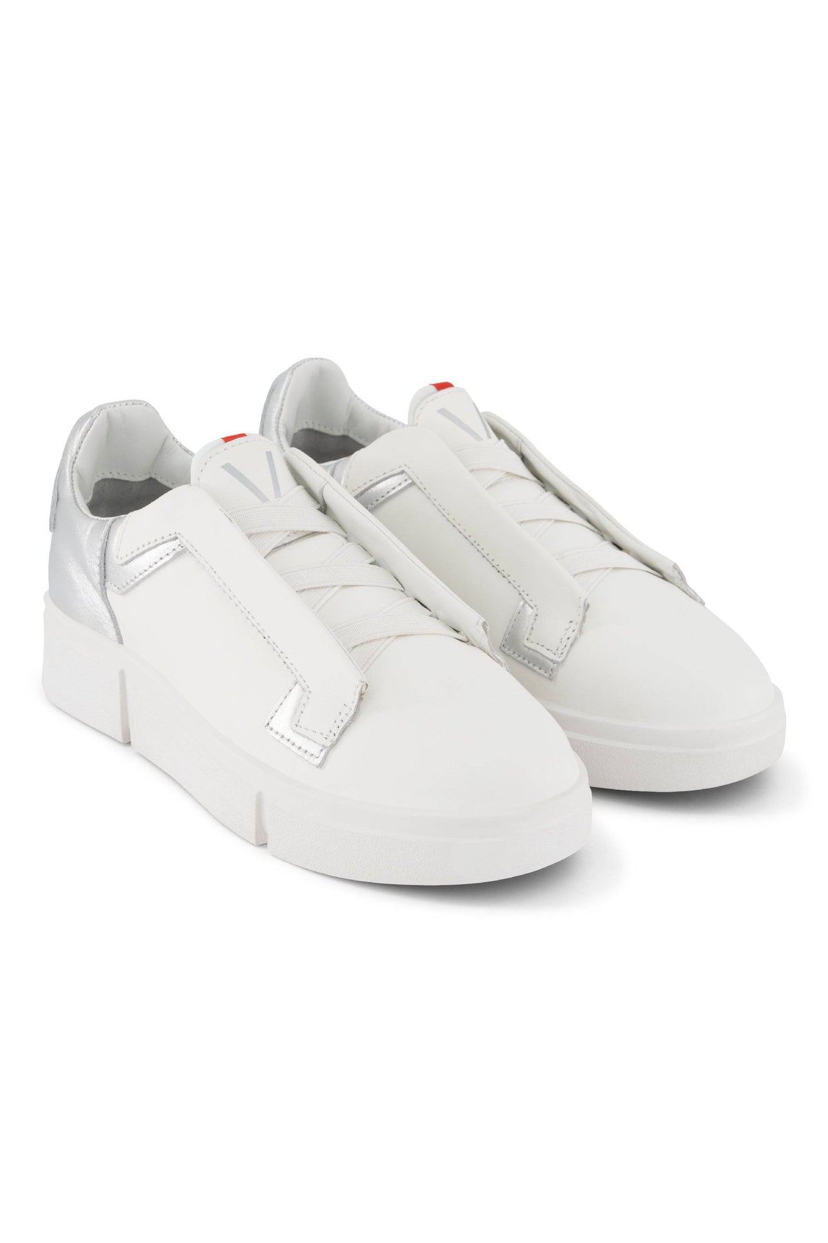 The Vassalli VS-004 White/Silver Laceless Sneaker features wide, flat Velcro straps and sleek white and silver heel detailing, shown against a white background.