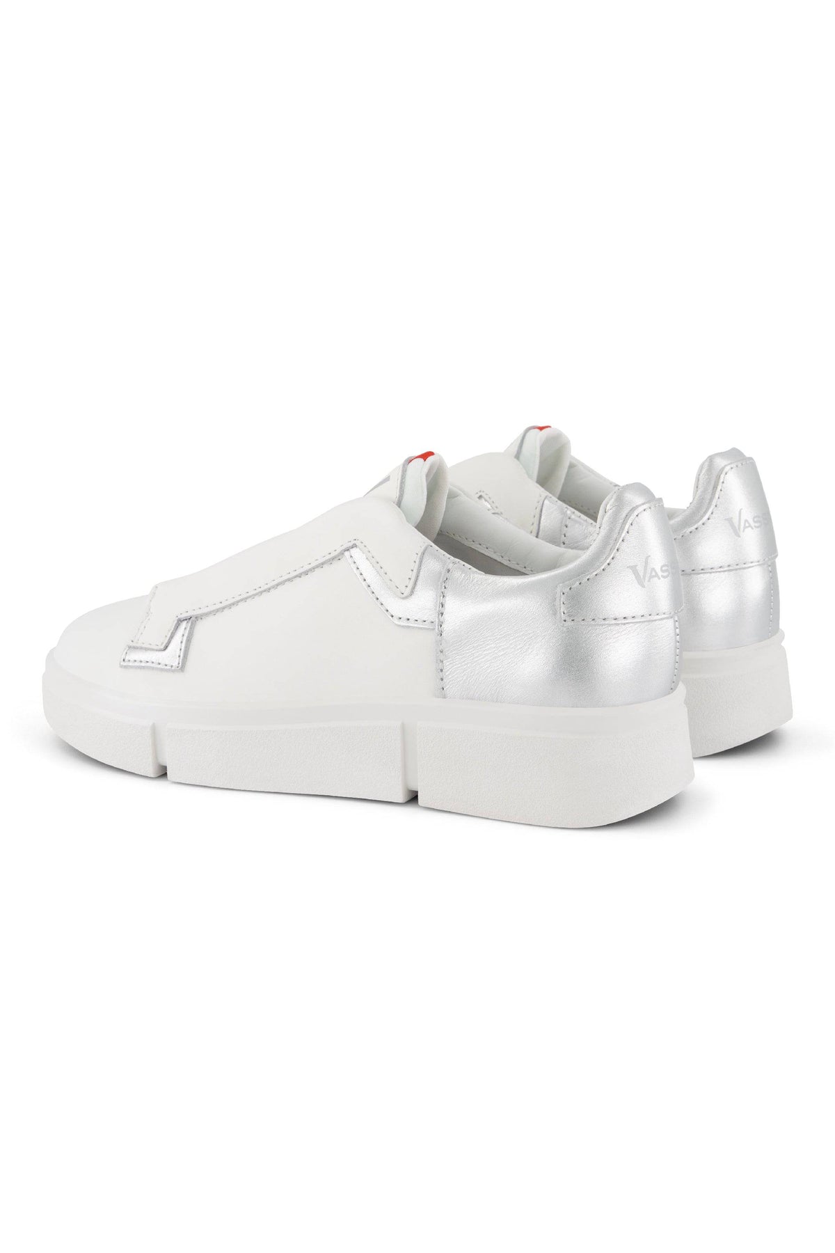 The Vassalli VS-004 White/Silver Laceless Sneaker features white leather, metallic silver heel detailing, and a chunky platform sole, shown from the back and side against a white background.