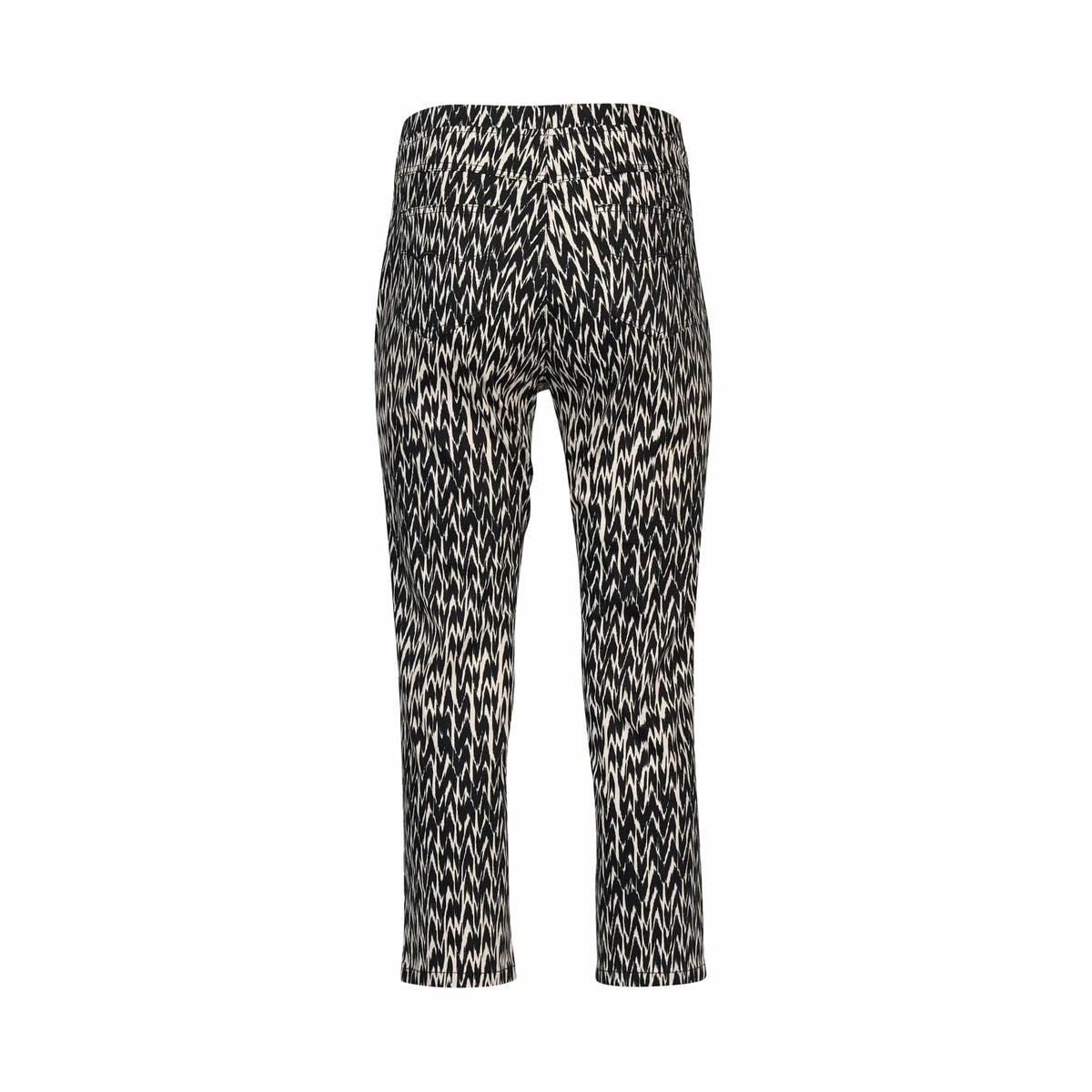 The Vassalli Sierra 7/8 Pant - Beau features a black and white abstract zigzag print, high waist, and tapered legs. This stretch pull-on pant is displayed from the back against a plain white background.