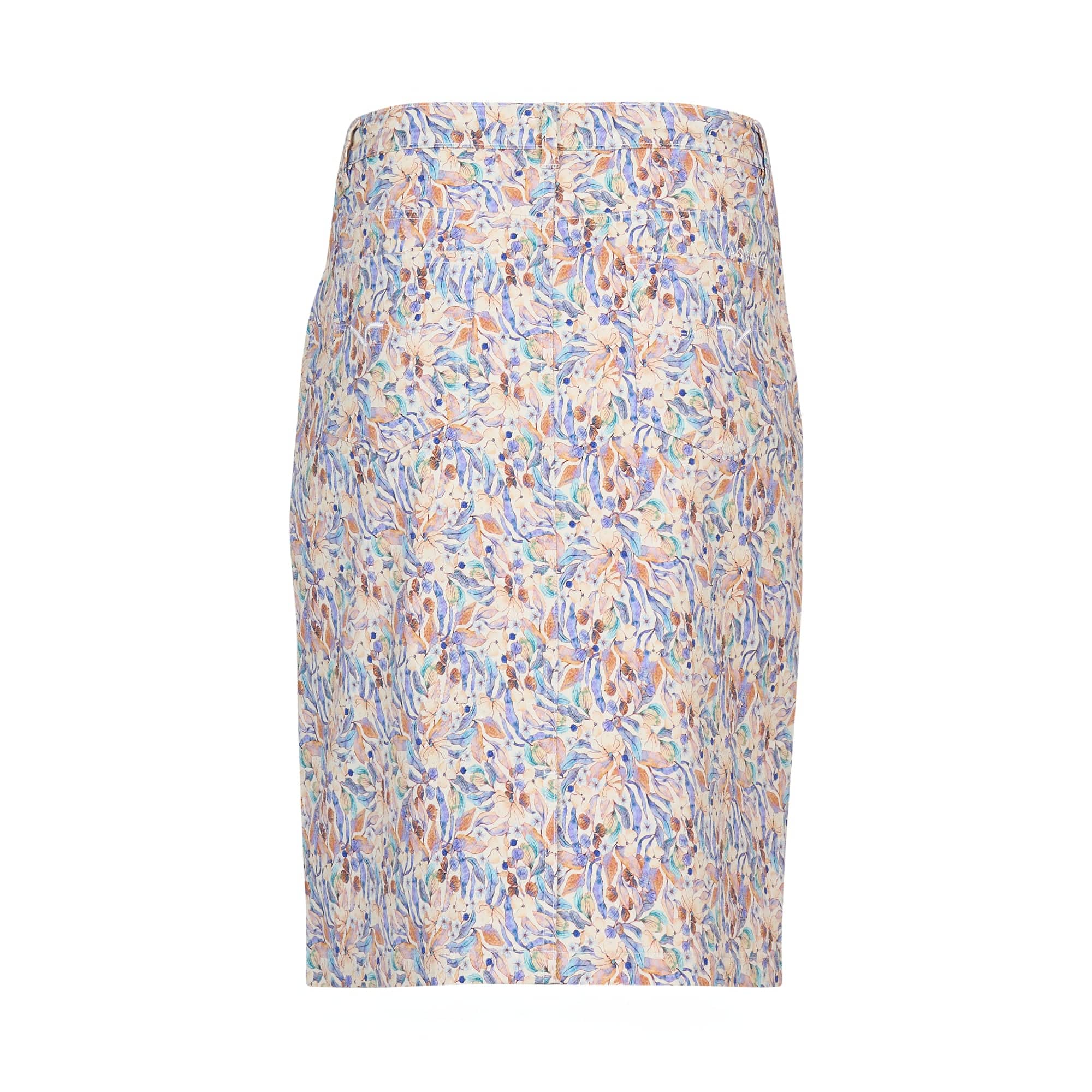 The Vassalli Poppy Skirt - Amalfi Denim is a knee-length, fitted denim skirt with a blue, peach, and green multicolored floral print on a light background, shown against white.