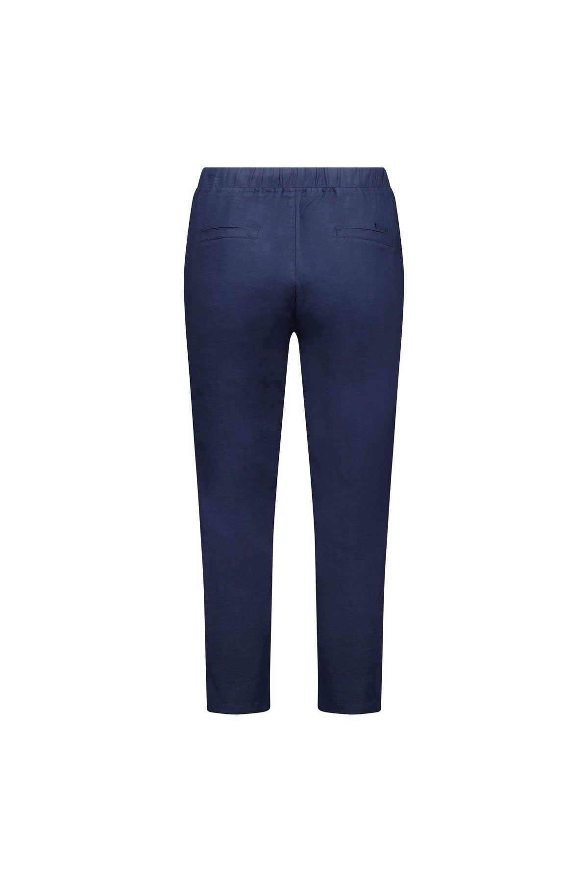 The Vassalli Denver 7/8 Pant in Ink is a navy blue, slim-fit ankle-length trouser with an elastic waistband and two welt pockets, crafted from a soft cotton blend and shown from the back on a plain white background.