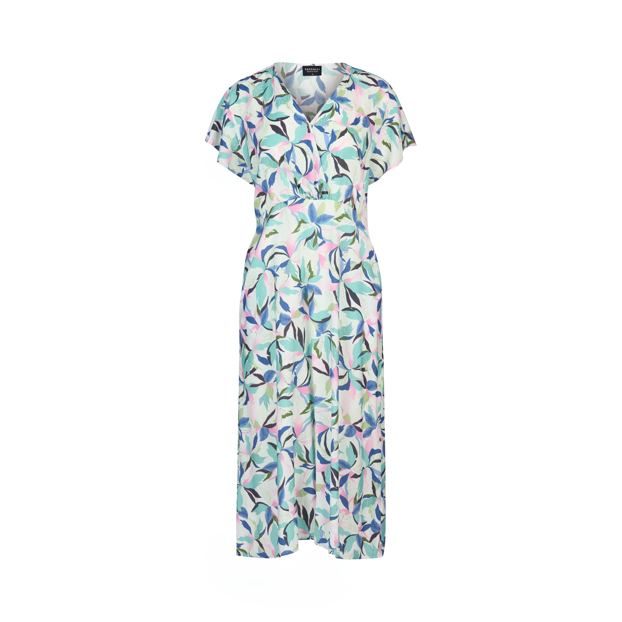 The Vassalli Drop Shoulder Dress - Soleil features a light, short-sleeved, V-neck midi silhouette with a fitted waist and bold green, blue, and purple leaf print on white. Displayed against a plain white backdrop.