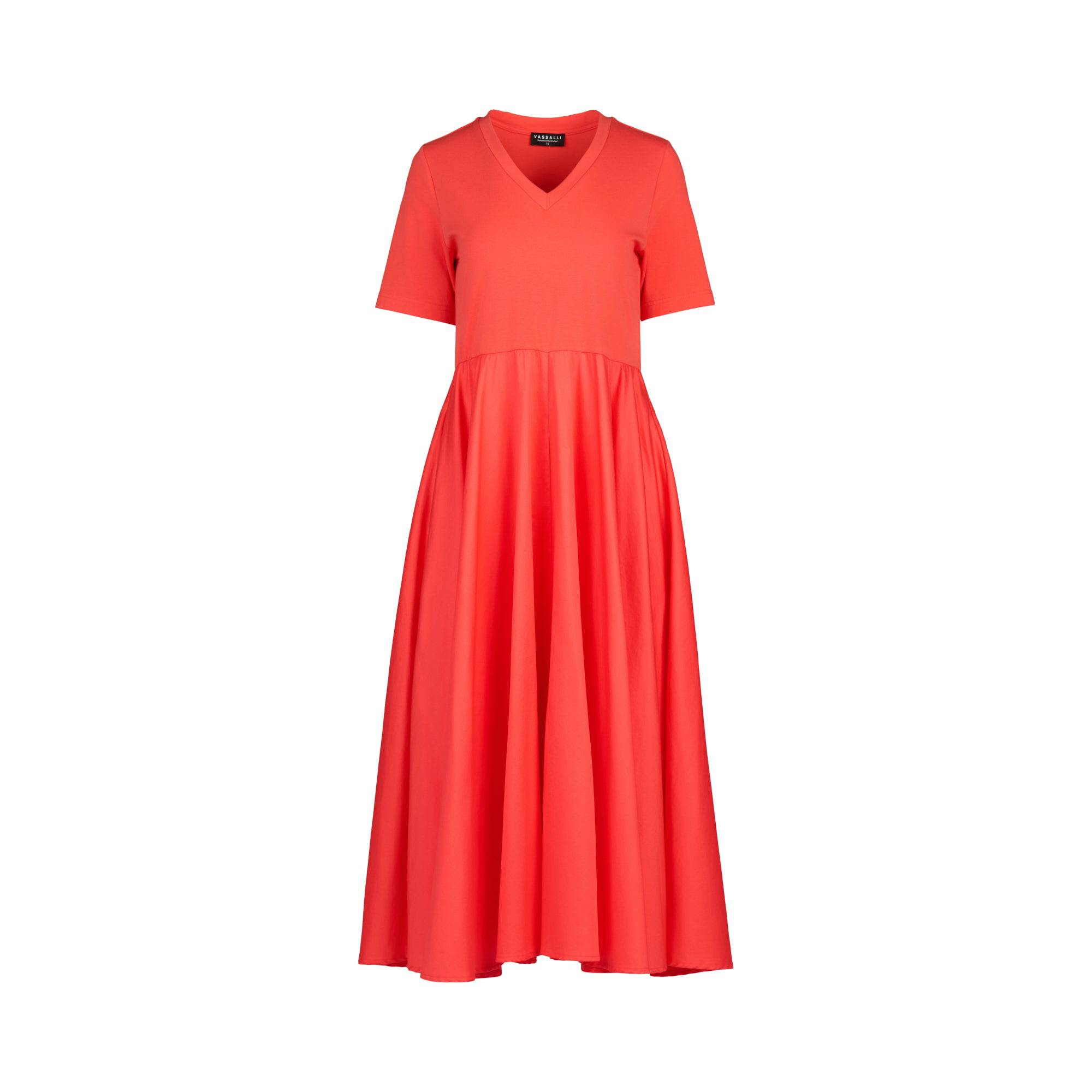 The Vassalli T-Shirt Dress - Aperol is a vibrant red, short-sleeved V-neck dress with a fitted bodice and flared skirt, crafted from soft cotton-elastane, shown on a plain white background.
