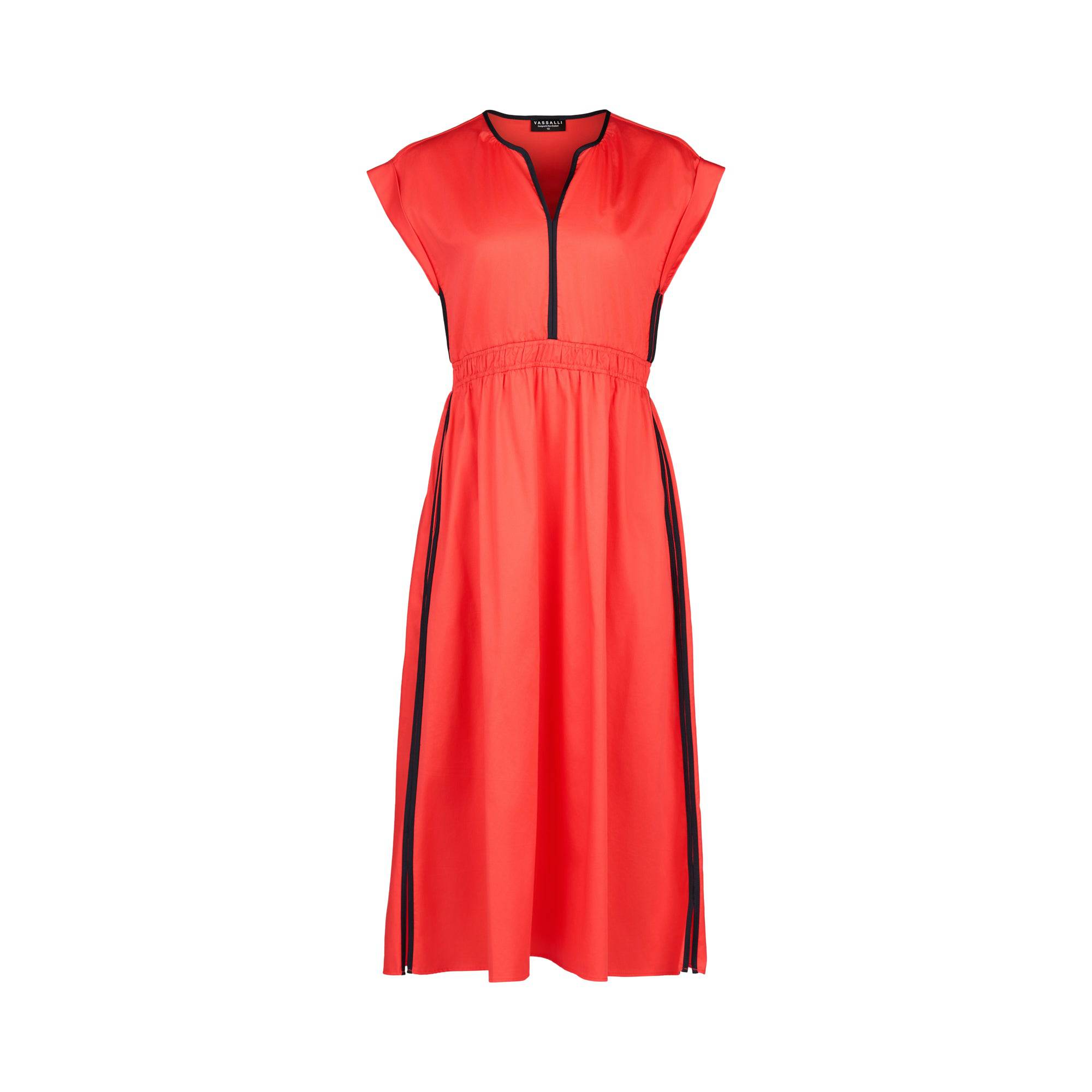 The Vassalli Emmie Dress in Aperol/Ink is a sleeveless cotton midi dress featuring a zippered v-neckline, black piping on the shoulders and sides, and an elastic waist. Shown on a plain white background.