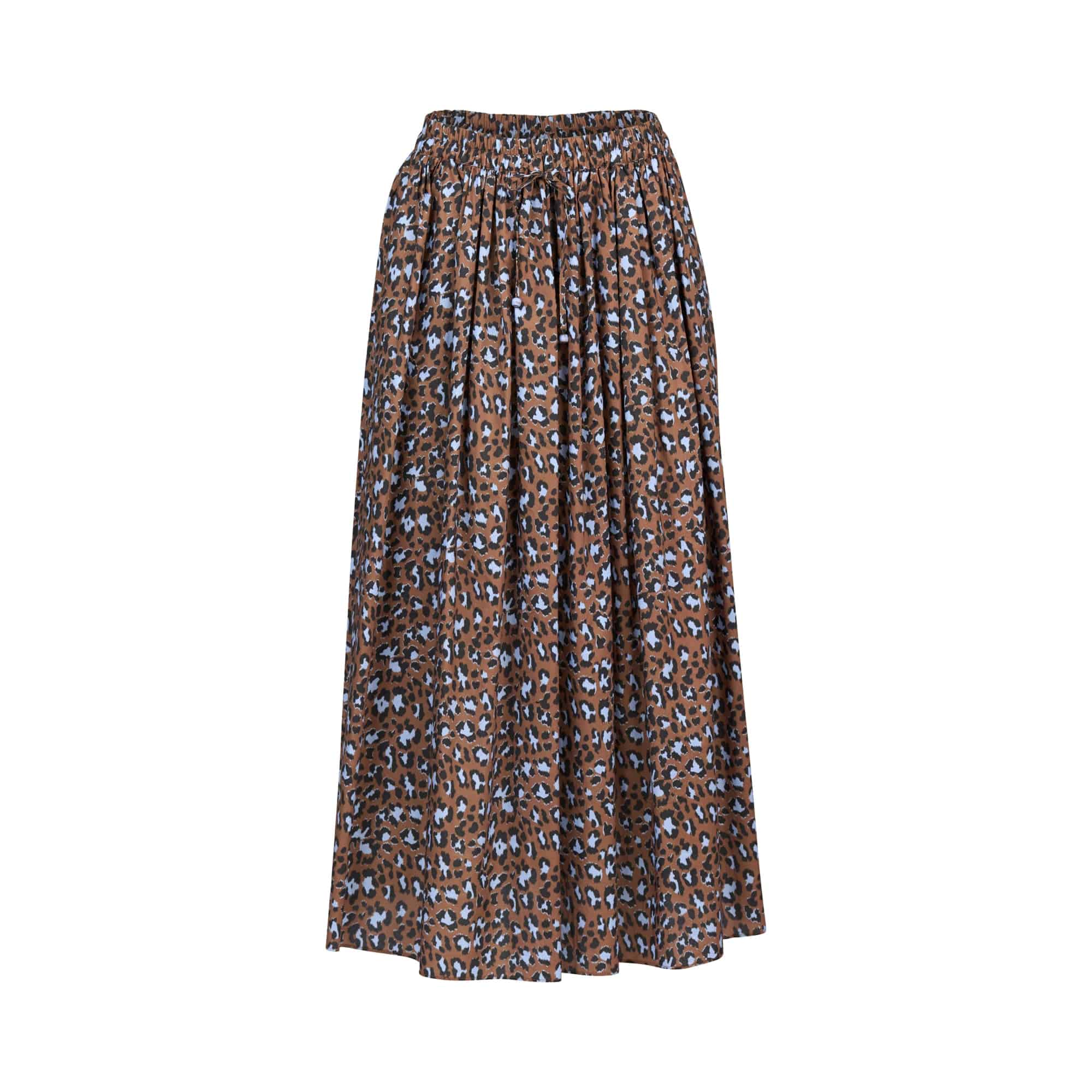 The Maxi Skirt - Nala by Vassalli is a brown printed cotton skirt with a light blue and black abstract spotted pattern, featuring a gathered elastic waistband and a loose, flowy silhouette.