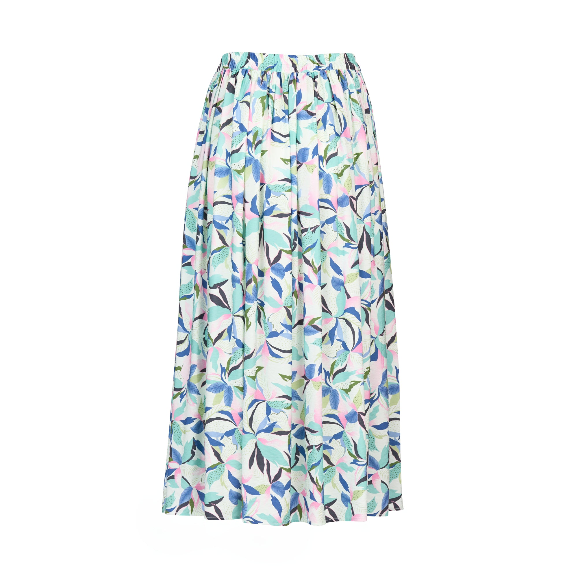 The Vassalli Maxi Skirt - Soleil features a colorful leaf print in blue, green, pink, and purple on white, with a gathered waistband and side pockets.