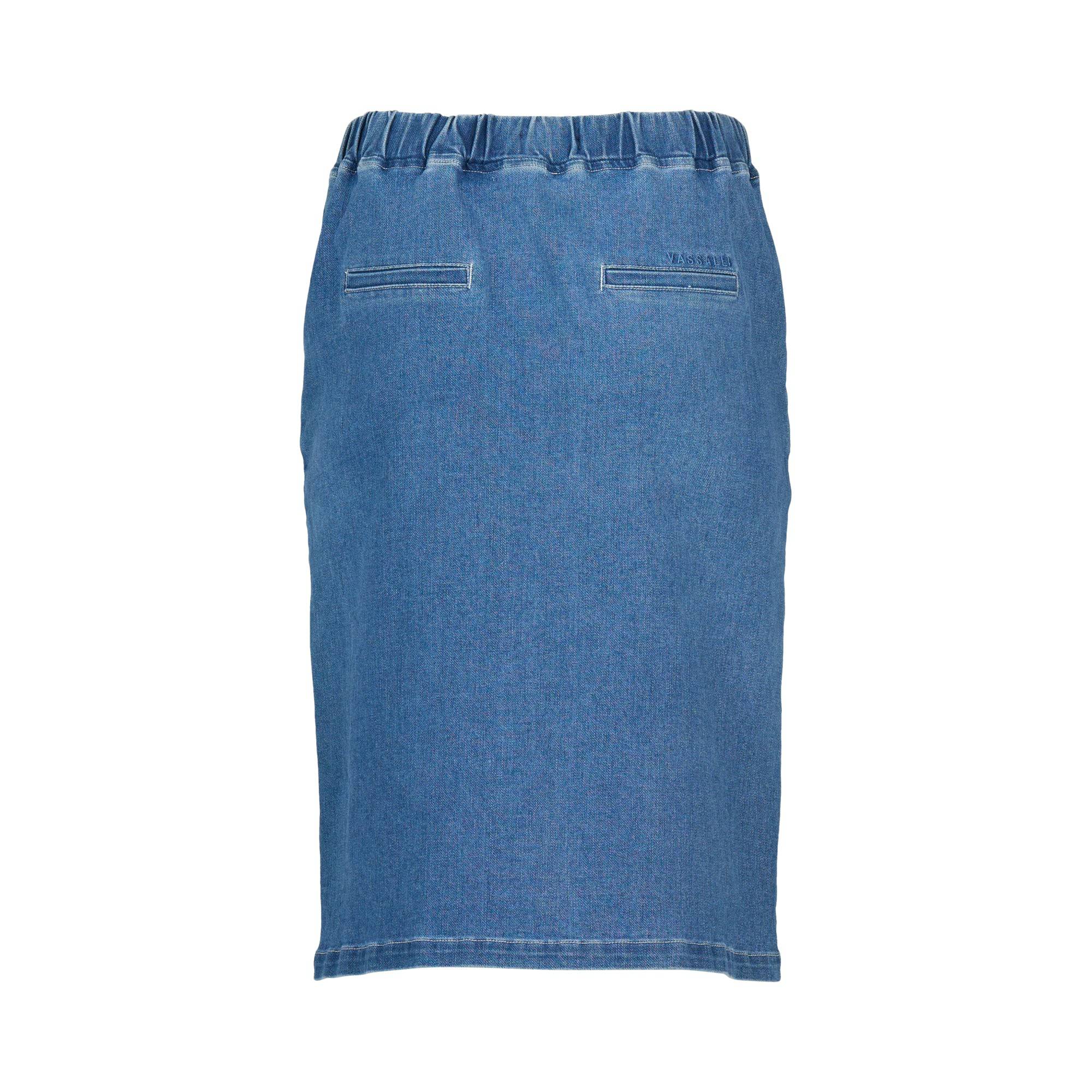 The Vassalli Terra Skirt in Blue Hue Denim is a knee-length stretch denim skirt with an elastic waistband and two back welt pockets, shown on a white background for a relaxed, casual look.